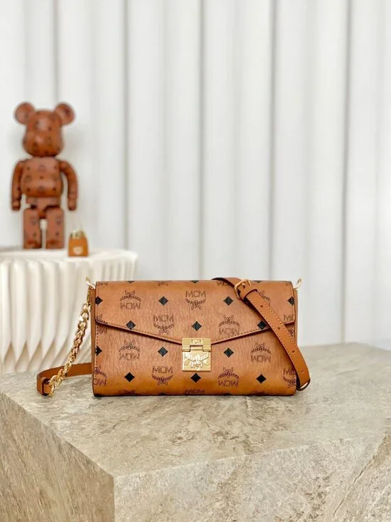 MCM Tan Monogram Clutch with Gold Accent - Picture 5 of 9